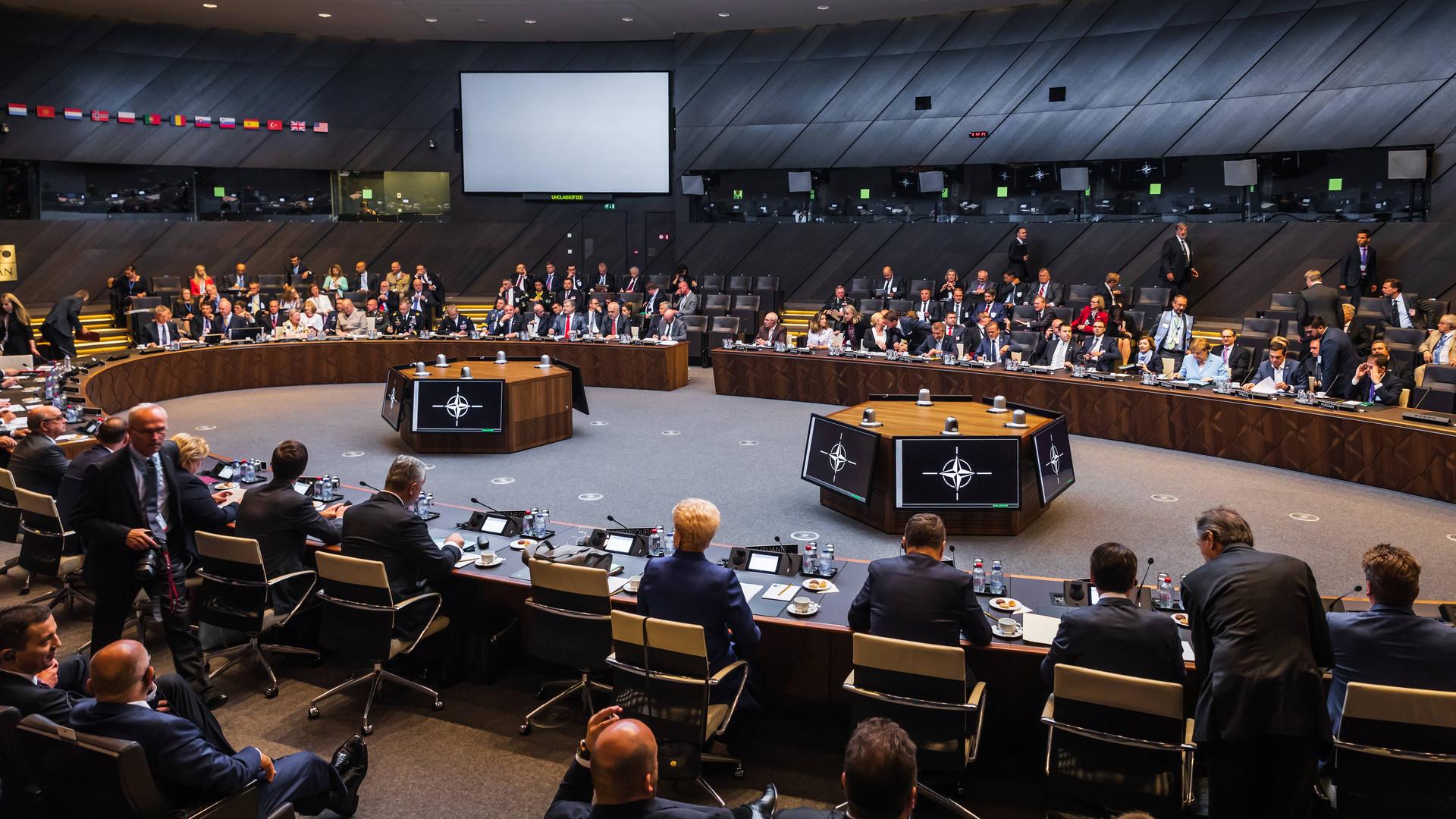 RECORD DATE NOT STATED BRUSSELS, BELGIUM - Jul 12, 2018: NATO military alliance summit. World leaders during a meeting of the North Atlantic Treaty Organization summit in Brussels , 35731560.jpg, alliance, atlantic, backstage, belgium, brussels, center, communication, conference, conversation, delegation, discussion, equipment, europe, european, event, group, headquarters, meeting, members, military, monitors, nato, negotiations, news, north, office, official, organization, participants, peace, people, policy, politics, safety, security, summit, talk, treaty, union, visit, work