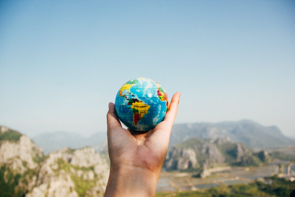 Small globe held in a hand