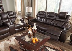 a living room with two couches and a coffee table