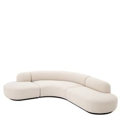 the curved sofa is white and has black legs