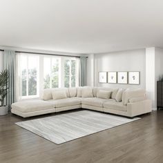 a living room filled with furniture next to a large white rug on top of a hard wood floor