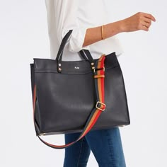 Crafted from high quality leather, our Essential Leather Tote features a spacious, open-tote design with leather carry handles and an adjustable, leather crossbody strap that can be swapped out for one of our colorful straps to create your own style. Add a foil debossed monogram to add a personal touch to your new everyday tote.    Small: 10"w x 5"d x 9"h  Large: 15"w x 5"d x 12.5"h  Camel: Smooth leather with a soft linen lining and gold-toned hardware.  Navy, Black, Sand: Pebbled leather with Cool Handbags, Handbag Essentials, Suede Tote, Work Tote, Everyday Tote, Painting Leather, Handbag Straps, Work Bag, Work Bags