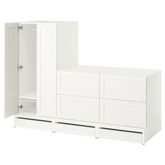 a white cabinet with doors and drawers on the bottom, next to it's shelf