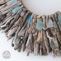 Make a splash with a magnificent 24 or 30" Salty Girl wreath! This wreath is sure to call attention to your coastal-style home when you place this work-of-art as the focal point of your carefully designed living room. You will be the envy of your friends and family! Shades of aqua and white sea glass and hand-selected small driftwood accent pieces harmonize this stunning nautical wreath with natural tones and coastal character. DETAILS: Dimensions: 24” x 2+" 30” x 2+" Ready to Hang: Wire Loop Ha Sea Glass Crafts Jewellery, Driftwood Sticks, Beachy Cottage, Beach Wreaths, Rope Wreath, Beach Christmas Decorations, Driftwood Wreath, Driftwood Diy, Nautical Wreath