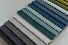 the colors of fabric are arranged in rows