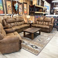 two couches and a coffee table in a store