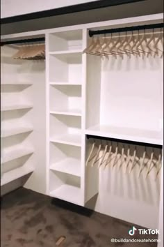 the closet is filled with white shelves and hanging clothes on hooks, which are also made from plywood