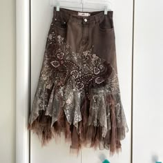 Rossi Roma Brown Denim Layered Ruffle Sequin Midi Skirt. Embroidered Flowers And Paisleys With Sequin Detailing. Raw Hem Lace Ruffle. Some Wear To The Lace/ Ruffle Bottom But Otherwise And Great Condition. Size Small **Matching Denim Top Available** Material: 76% Cotton, 14% Nylon, 10% Elastane Waist: 27 Inches Approx Length: 30.75 Inches Approx Tags Y2k Vintage Rare Coquettegirl Romantic 90s Maximalism Lace Layered Skirt Edgy Fall Autumn Jean Skirt Free People Like Anthropologie Like Urban Outf Transformative Clothing, Brown Midi Skirt Outfit, Ruffle Jean Skirt, 90s Maximalism, Layer Outfits, August Style, Tool Skirt, Knit Sweater Skirt, Clothes For Ocs