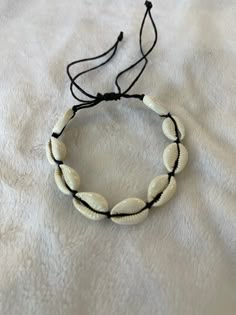 Cowrie Shell Bracelet with adjustable cord Beaded Shell Bracelet, Bracelet Ideas String, Surfer Bedroom, Cowrie Necklace, Long Sleeve Blouse Designs, Sleeve Blouse Designs, Puka Shell Bracelet, Afro Jewelry, Cowrie Shell Bracelet