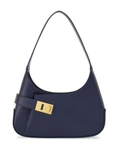 Find SALVATORE FERRAGAMO Medium Hobo Leather Shoulder Bag on Editorialist. This Ferragamo hobo shoulder bag is crafted from calf leather and features gold-tone hardware. It has a Gancini buckle, tonal stitching, top zip fastening, single shoulder strap, main compartment, internal card slots, internal logo stamp, front patch pocket, and leather lining. It is a medium-sized bag that can be worn on the shoulder. Ferragamo Bag, Hobo Shoulder Bag, Girly Bags, Iconic Bags, Pretty Bags, Navy Leather, Logo Stamp, Cute Bags, Blue Bags