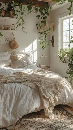 an unmade bed in a bedroom with plants on the wall and potted plants