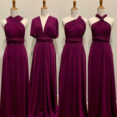 three bridesmaid dresses on mannequins in front of a white wall