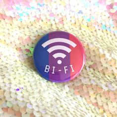 a button with the word bi - fi on it sitting in front of colorful confetti