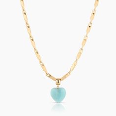 Our favorite new gemstone puffy heart in amazonite strung along this shimmering, geometric chain makes for a luminous & chic statement necklace. 14k gold plated 3 mm Getty lumina (triangle bar link) chain with carved amazonite puffy heart charm. Adjustable between 16-18". PRODUCT NOTE: Carved stone may vary in texture, color, shape and size. These subtle differences make each piece unique. Charm measures approximately: 19 mm x 17 mm x 6 mm Triangle Bar, Necklaces With Meaning, Puffy Heart Charms, Bracelets With Meaning, Silver Rings With Stones, Carved Stone, Heart Gemstone, Puffy Heart, Texture Color