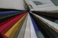 an assortment of different colors of fabric