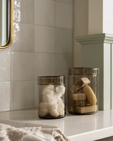 Glass Canisters Bathroom, Bathroom Canister Ideas, Bathroom Jars, Mcgee And Co, Bathroom Canisters, Bathroom Counter Decor, Vanity Counter, Neutral Bathroom, Kitchen Jars