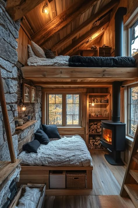 Tiny Mountain Home With a Compact Cozy Stone Fireplace. Check out and drool over all of these enchanting mountain homes with stone fireplaces–the ultimate cozy and rustic retreats. Rustic One Room Cabin, Cozy Tiny Room, Stone Cabins And Cottages, Nature Themed House, Stone Cabin Interior, Tiny Cabin Loft, Small Cabin Interiors Cozy, Rustic Tiny House Interior, Tiny Stone House