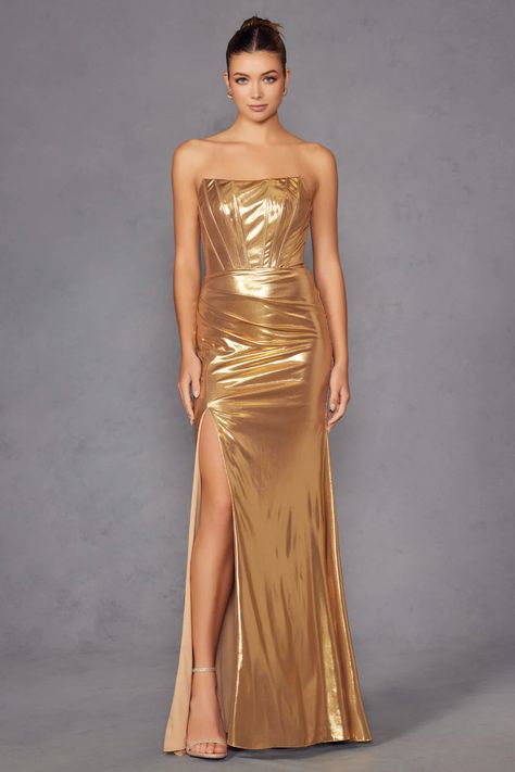 Juliet Luxe Metallic Strapless Slit Evening Gown JT2500A Make a statement in this breathtaking strapless metallic gown by Juliet JT2500A, designed to exude elegance and sophistication. Crafted from shimmering metallic fabric, this dress catches the light beautifully, ensuring all eyes are on you. The strapless straight-across neckline offers a timeless silhouette, while the corset boning provides structure and support. Delicate ruching along the back enhances curves, adding depth and texture. Fl Metallic Gown, Straight Across Neckline, Statement Heels, Long Evening Dress, Ruched Bodice, Metallic Fabric, The Dazzling, Wholesale Dress, Luxurious Fabric