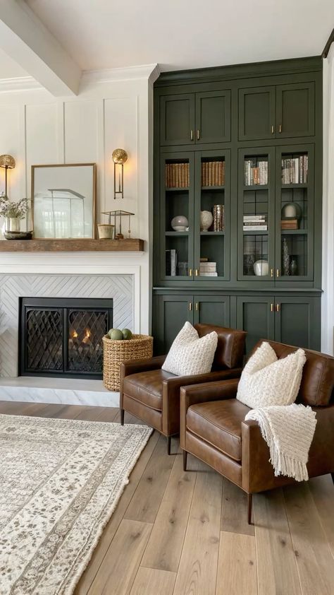 These beautifully curated interiors radiate warmth and sophistication. Neutral tones, layered textures, and timeless design details create a cozy yet elevated atmosphere. From statement cabinetry to natural accents, let these living spaces inspire your next design refresh. #TimelessInteriors #WarmAndWelcoming #NeutralDecor #LivingRoomGoals #InteriorInspiration #RefinedLiving #HomeStyle #cozyelegance Traditional Home Inspiration, How To Decorate 2 Story Living Room Wall, Green Cabinets Living Room, New Traditional Home Design, Unique Living Room Designs, Cottagecore Modern Living Room, Homes With Character Interior, Living Room European Style, Cozy Colonial Living Room