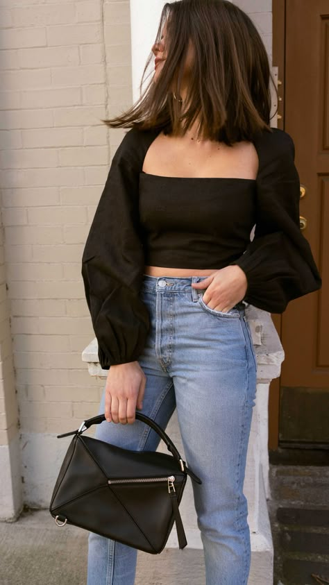 Sarah Butler of Sarah Styles Seattle wears Mara Hoffman Moon Crop Top with Gathered puff sleeves in black and Loewe Small Puzzle Shoulder Bag  | @sarahchristine, Seattle Blogger Puff Sleeve Top Outfit, Sarah Christine, Black Top Outfit, Off The Shoulder Top Outfit, Classy Ootd, Seattle Fashion, Top With Jeans, Crop Top With Jeans, Crop Top Outfits