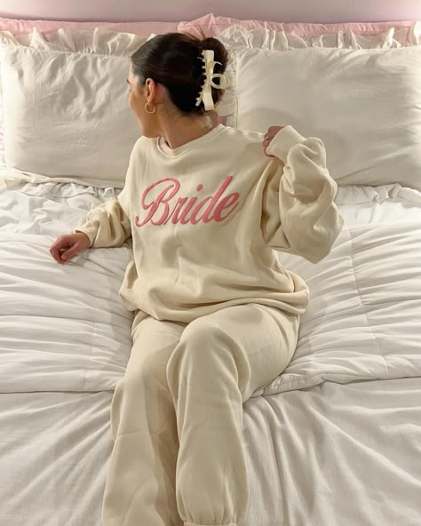 13 Best Bachelorette Outfit Ideas That Look Stunning - The Wandering Girl Airport Bride Outfit, Bachelorette Lounge Wear, Bachelorette Matching Sweat Suits, Last Rodeo Bachelorette Party Outfit Bride, Bride Lounge Wear, Bridal Travel Outfit, Bachelorette Bride Outfit Casual, Bachelorette Matching Ideas, Comfy Bachelorette Outfit