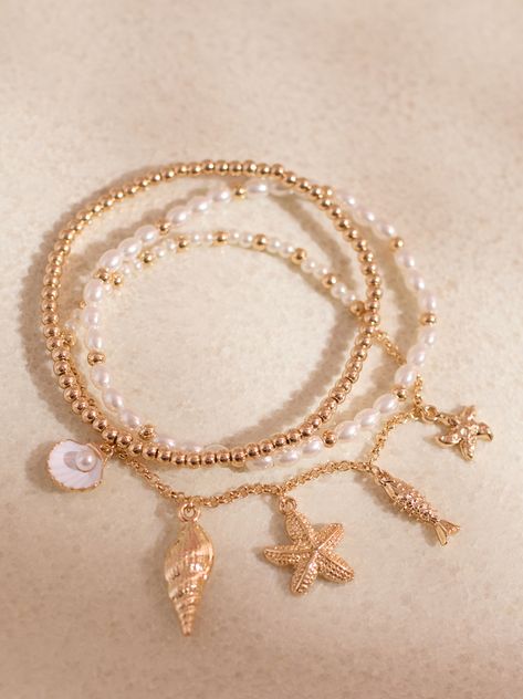 Dive into elegance with this delicate bracelet set, where the beauty of the ocean meets timeless sophistication. Adorned with delicate sea life charms such as starfish, seashells, and more, each bracelet tells its own ocean-inspired story. Ocean Inspired, Ocean Inspiration, Sea Life, Delicate Bracelet, Under The Sea, Starfish, Bracelet Set, Sea Shells, The Ocean