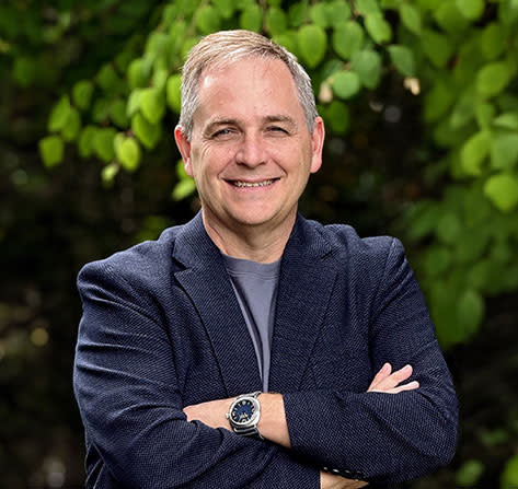 Headshot of Marc Whitten, CEO - trees background