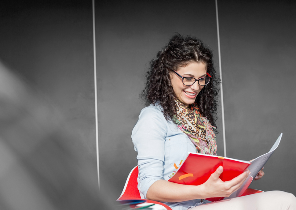 Happy woman reading direct mail