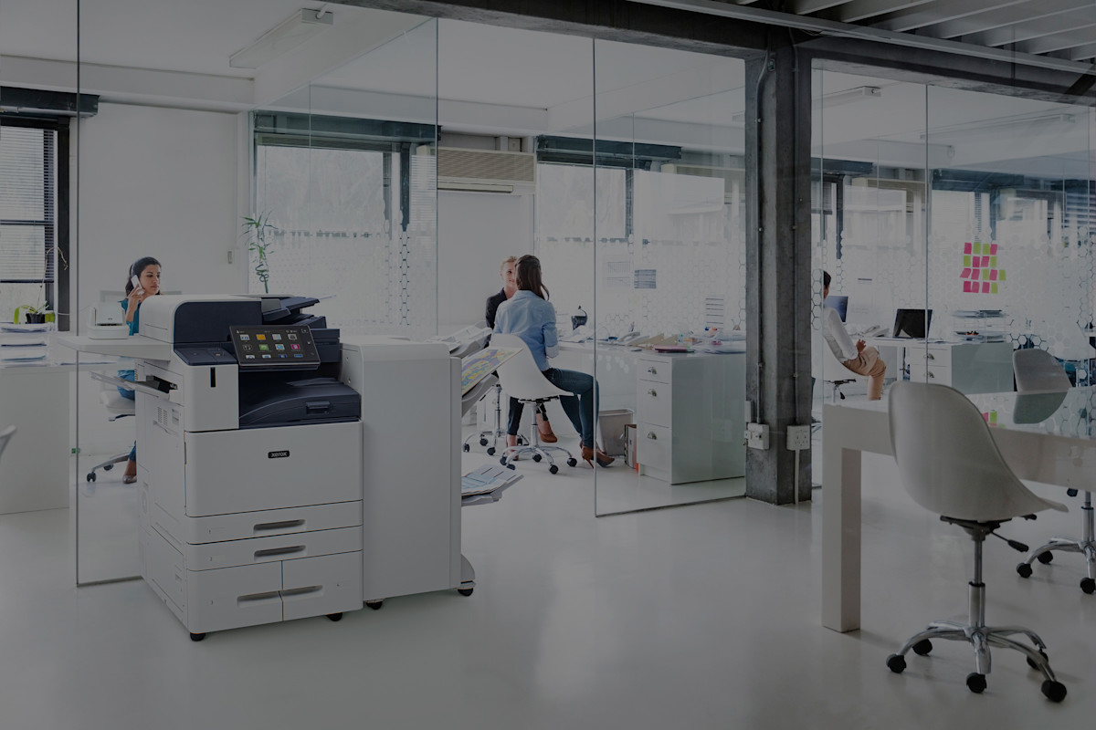 Bright open office with an AltaLink C8100 Series multifunction printer