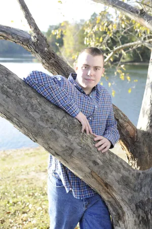 Myself leaning on a tree.