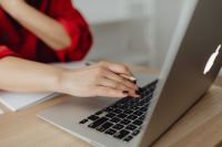 Kaboompics - A woman works at a desk in her home