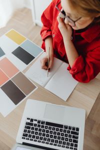 Kaboompics - A woman works at a desk in her home