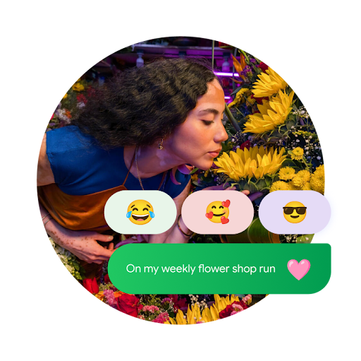 A picture of a person smelling sunflowers in a flower shop is overlayed by a green text bubble that reads "on my weekly flower shop run" next to a pink heart emoji. Above it are three reaction emojis: a crying, laughing emoji, a smiling emoji with hearts around it, and an emoji with sunglasses.