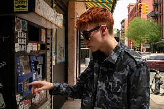 A person using an ATM machine.