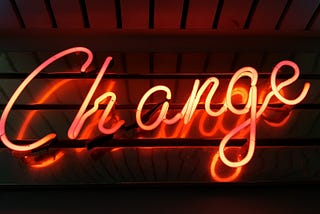 Neon with the word “Change”