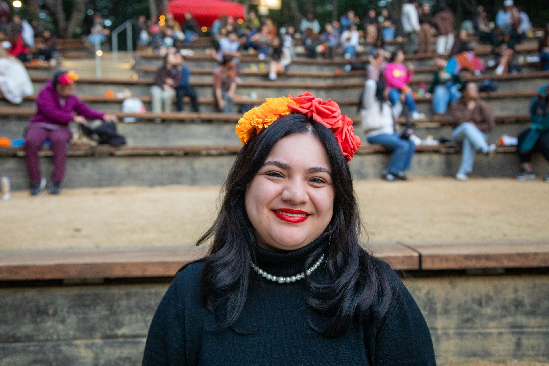 A student smiling at the Dia de los Muertos event