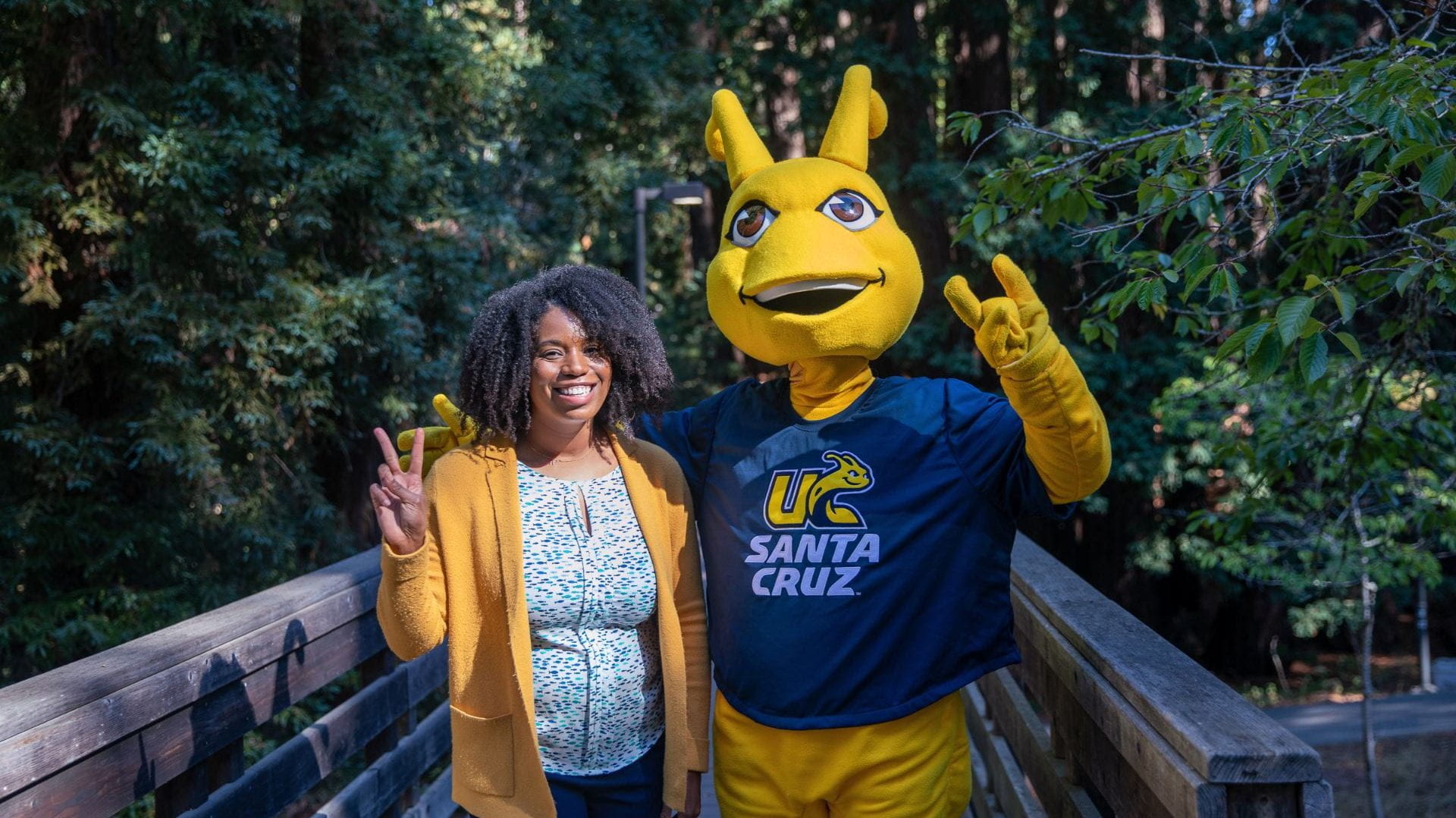 Sammy Slug standing next to Vice Chancellor, Akirah Bradley-Armstrong