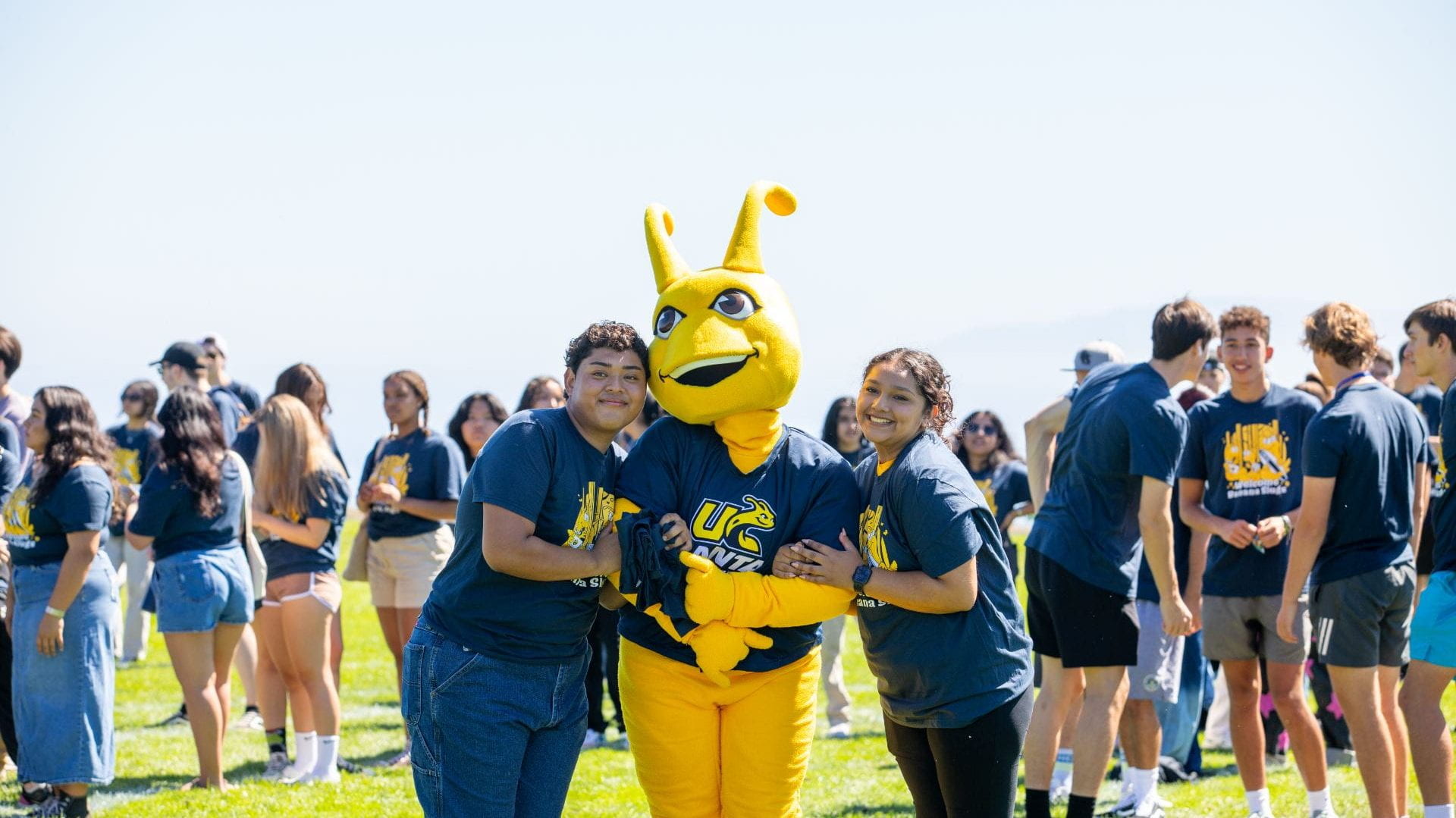 Sammy Slug with two students at class picture day