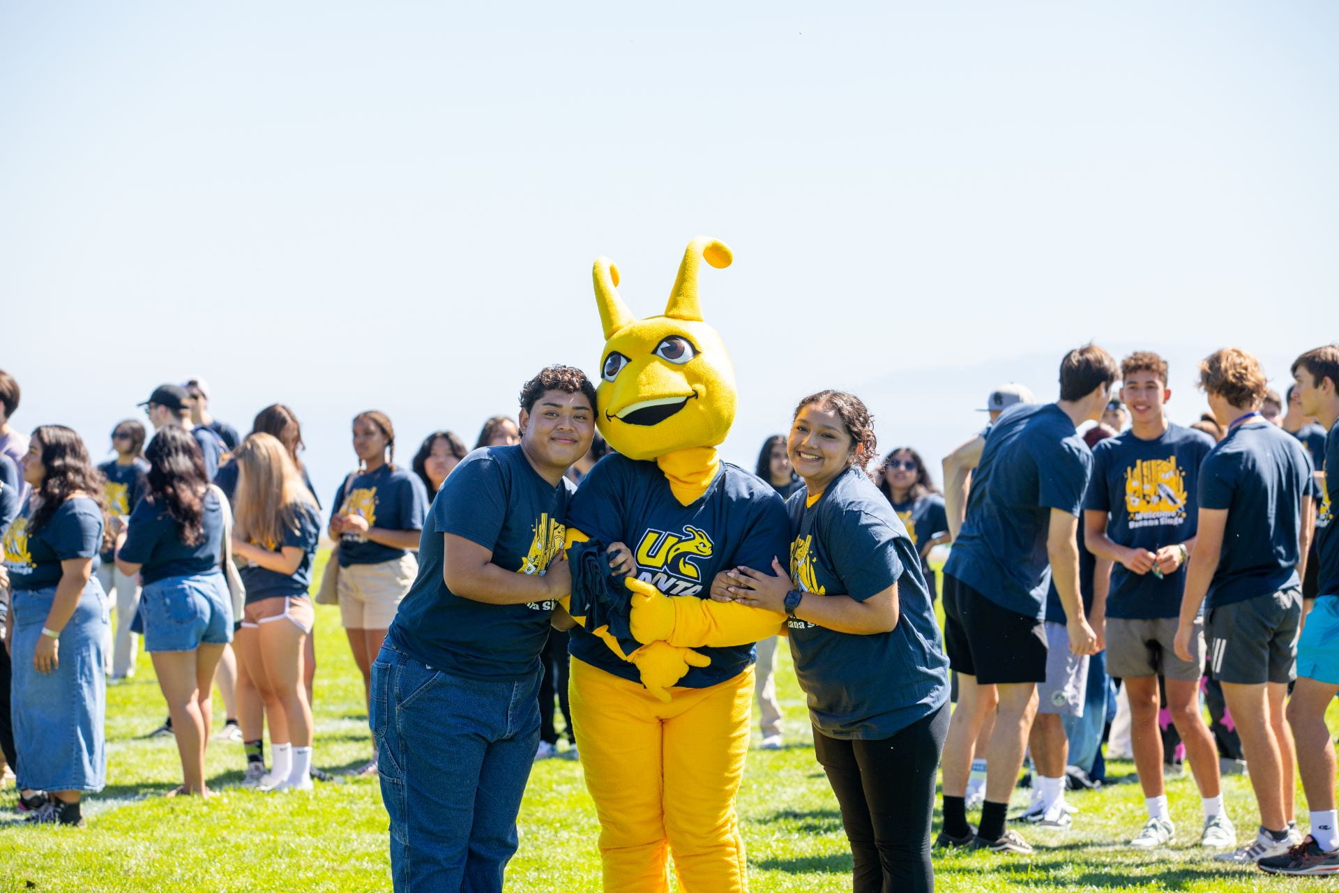 Sammy Slug with two students at class picture day