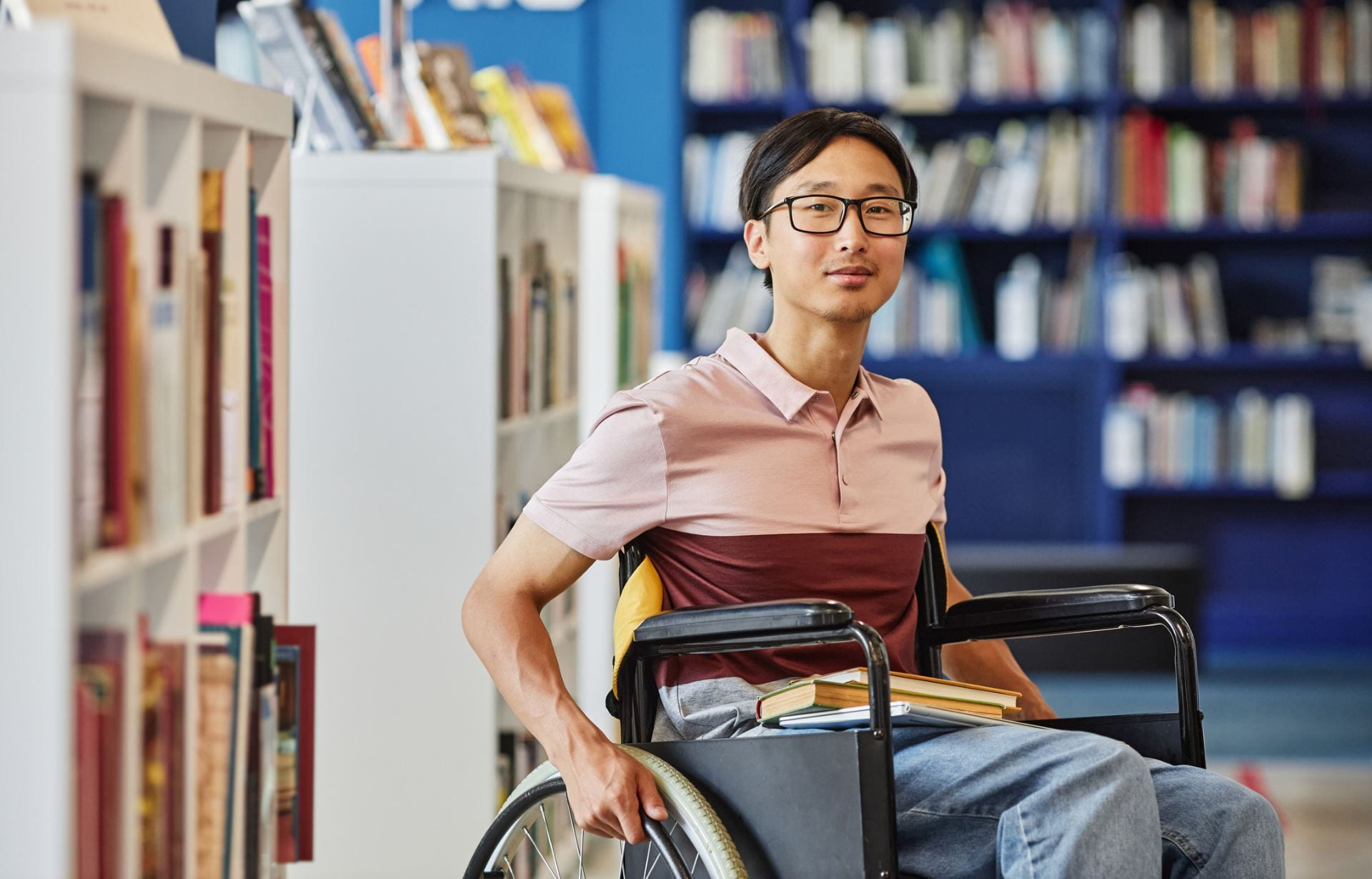 A student in a wheelchair smiling