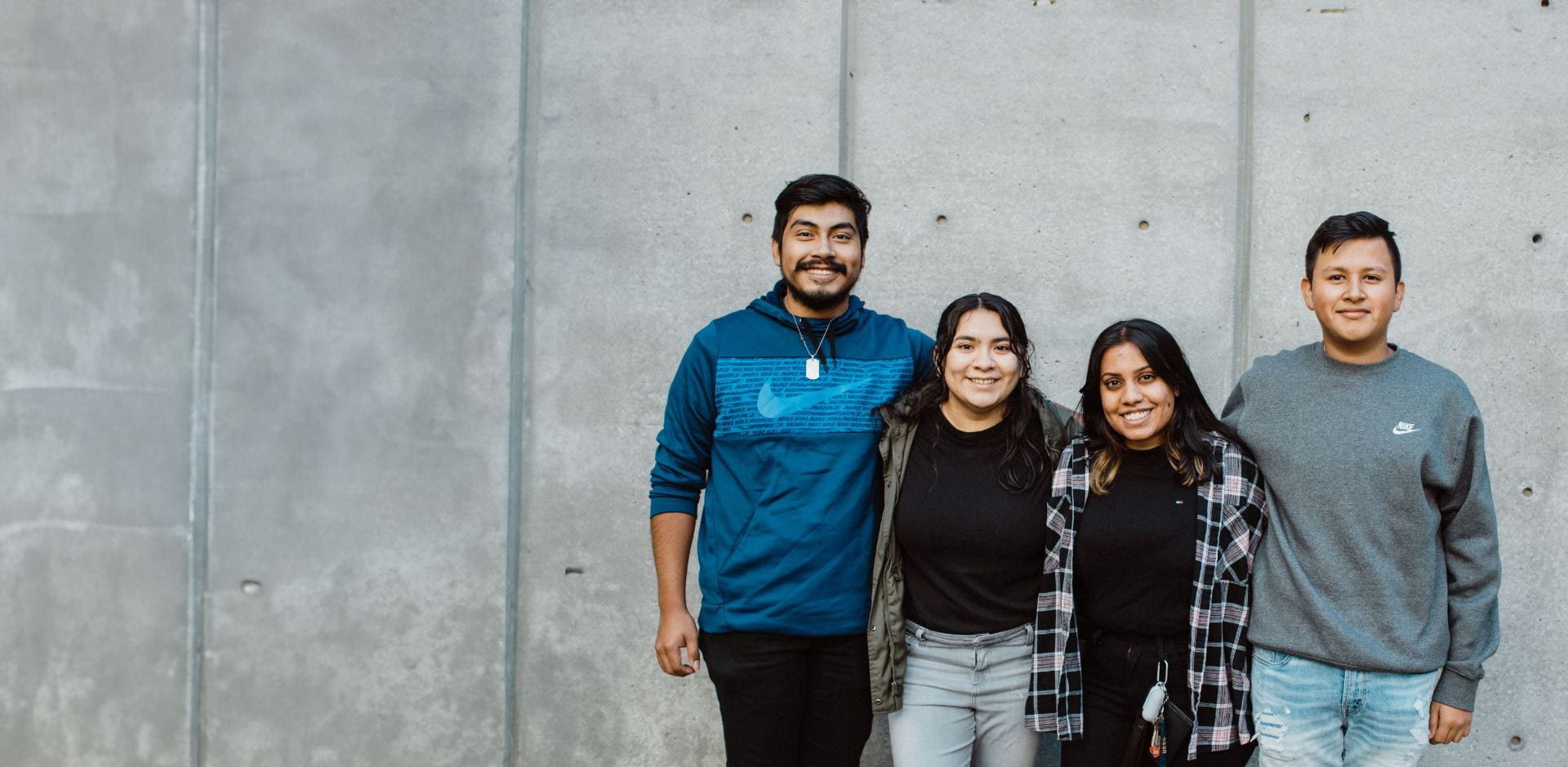 Four students smiling 