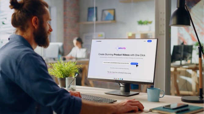 man sitting in front of computer screen