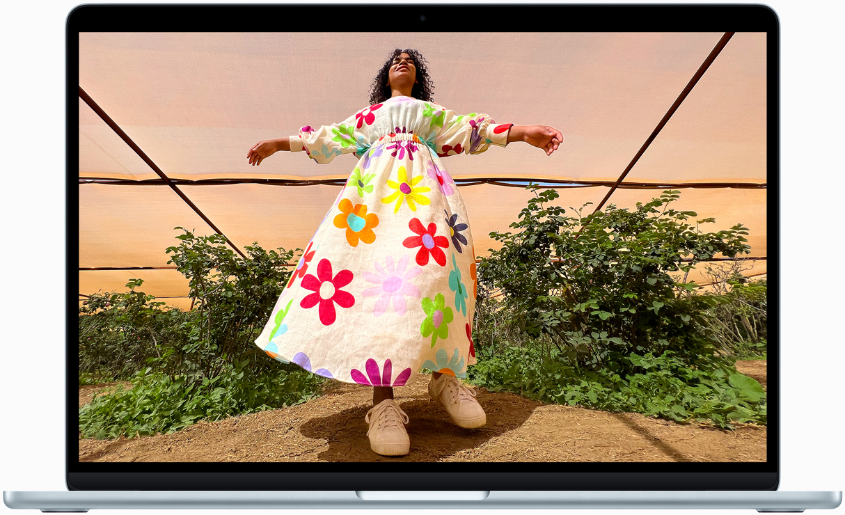 MacBook Air screen showing photo of person in colourful outfit, demonstrating colour range and resolution of Liquid Retina display