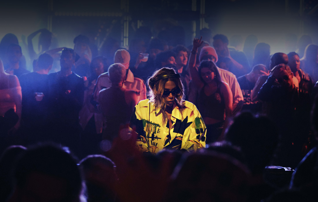 A performer on a stage at a live music concert.