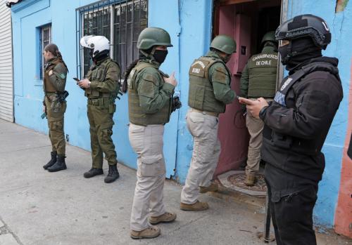 Members of the Carabineros evict a house in Santiago after complaints of drug sales on September 3, 2024.