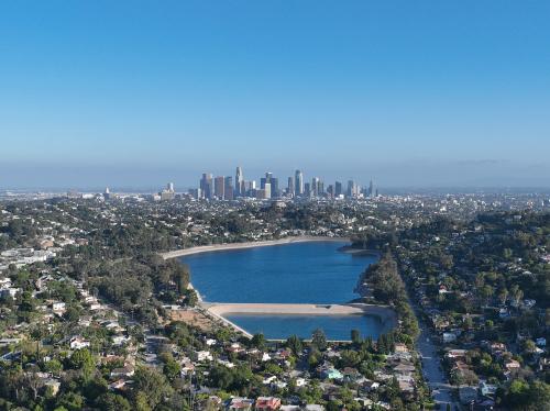 Aerial view of Silver Lake reservoir with downtown Los Angeles skyline