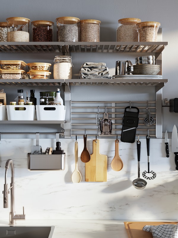 An organized wall with kitchen accessories