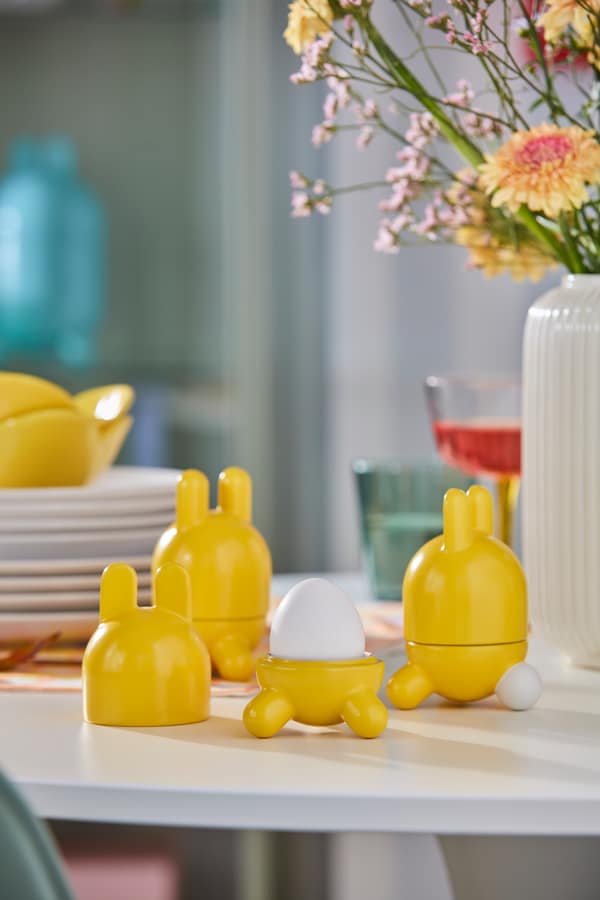 An yellow TJÄRLEK egg cup