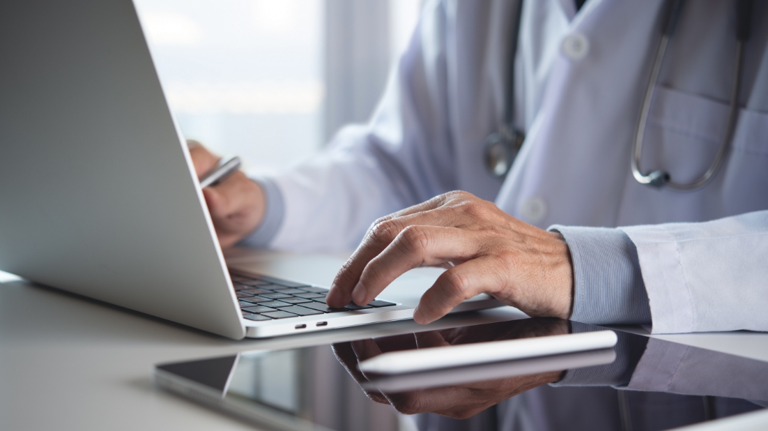 Doctor working on his laptop 